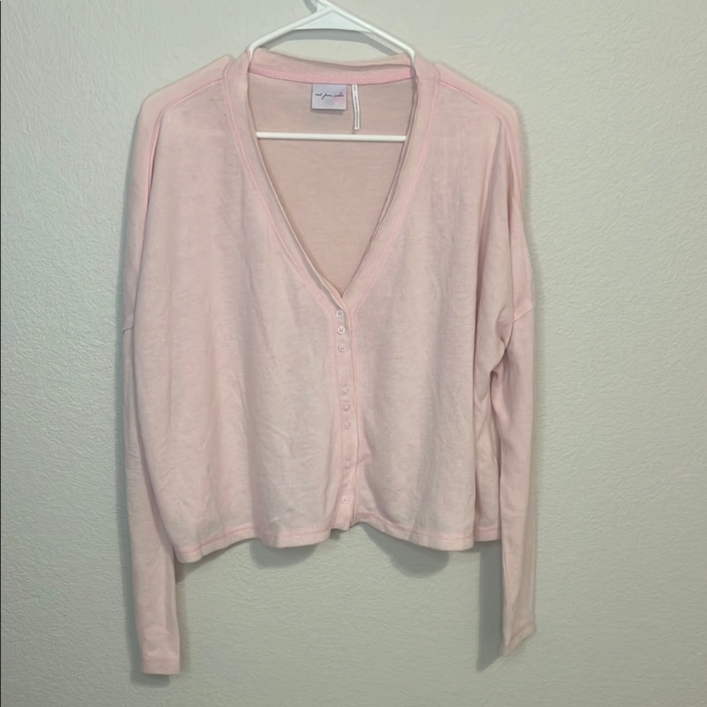 Out from under Pink Cardigan
